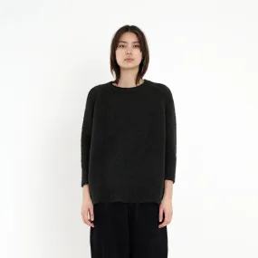 7115 by Szeki Black Airy Exposed Seams Sweater