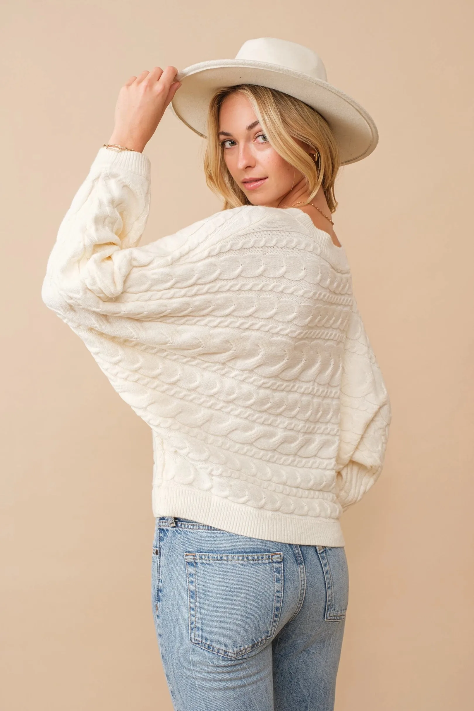 Horizontal cable knit dolman sleeve sweater